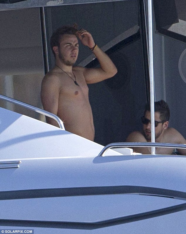 Chilled: Gotze won £240,000 from the World Cup with Germany and was on holiday with friends to celebrate