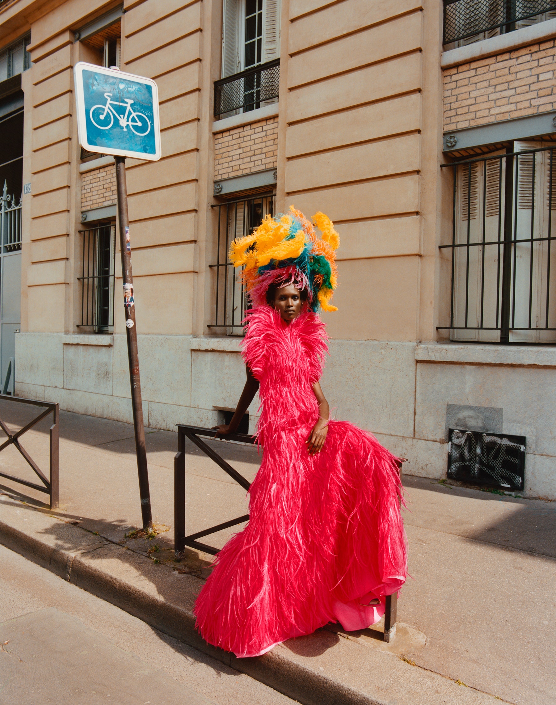 Amar Akway wears a Valentino Haute Couture gown; Valentino Garavani sandals; stylist’s own headpiece...