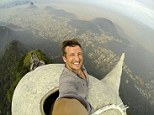 The ultimate selfie? Travel company boss Lee Thompson was allowed to climb the 130ft-high Christ The Redeemer statue in Rio de Janeiro, taking a selfie as he reached the top