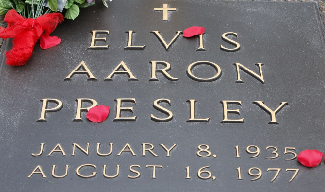 Flowers are shown on the grave of Elvis Presley at Graceland, Presley's home in Memphis, Tenn.,, Presley's 75th birthday Elvis At 75, Memphis, USA