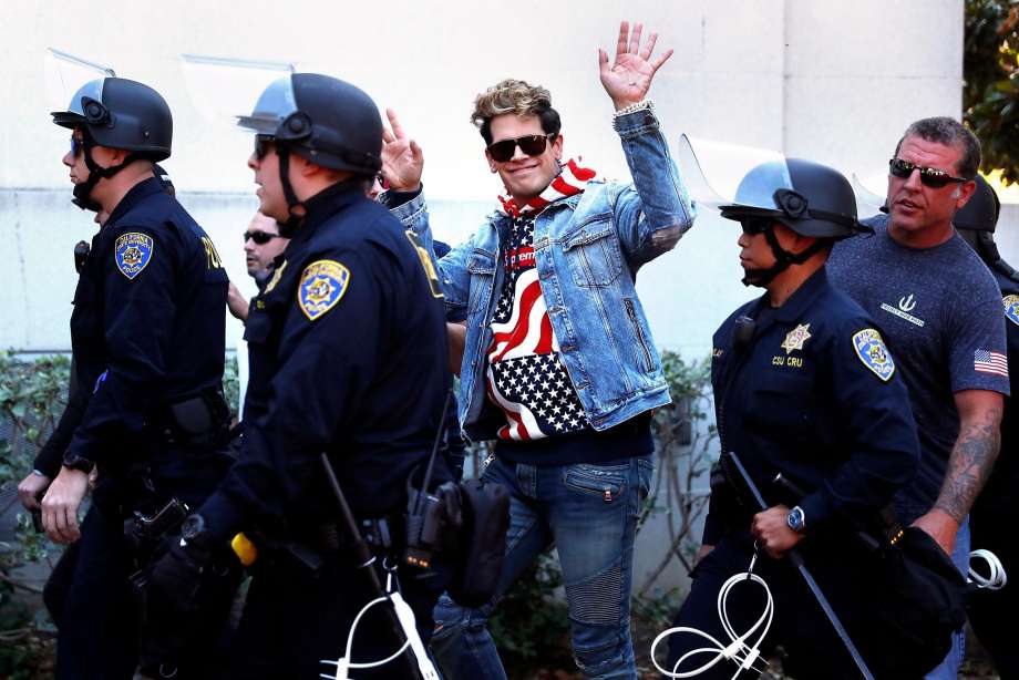 Trump supporters Ben Bergquam (back, left) and Roger Walus (back right) yell out as anti-Trump supporters Sunsara Taylor (center,bottom) and others demonstrate outside UC Berkelely in Berkeley, Calif., on Sunday, Sept. 24, 2017. Photo: Gabrielle Lurie, The Chronicle