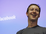 FILE - Facebook CEO Mark Zuckerberg smiles during an announcement at Facebook headquarters in Palo Alto, Calif., in this July 6, 2011 file photo. Facebook and its founder must release documents and electronic correspondence to a defense lawyer whose client has fled from criminal charges that he falsely claimed a majority ownership in the social media giant, a federal judge said Friday April 3, 2015. (AP Photo/Paul Sakuma, File)