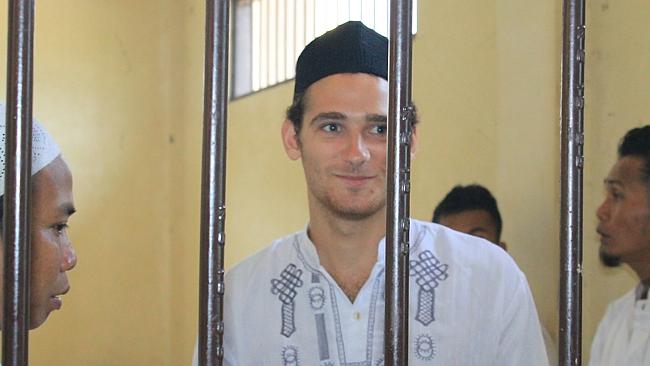 Matter of faith ... Jake Drage in a waiting cell at the Cibadak District Court in Sukabum