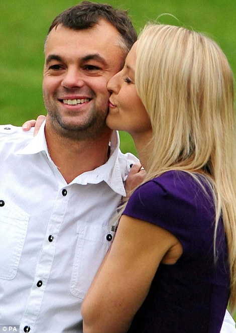 Lucky: Gareth Bull, pictured with wife Catherine after his win, was a self-employed builder and only bought his winning ticket because a job was delayed