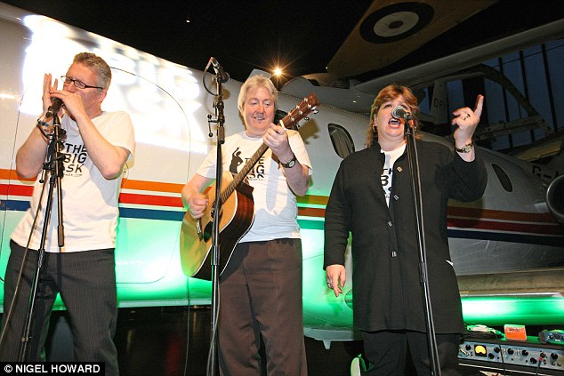 Eccentric Opik has tried to reinvent himself many times, with TV appearances and musical performances. Pictured, he performs with MPs Ian Cawsey and Emily Thornbury at a concert to promote climate change