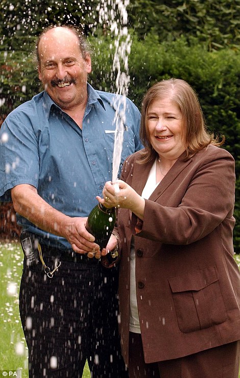 Football fan: Thea Bristow, pictured celebrating her win with late husband Paul, won £15million in 2004. She is now Chairwoman of club Torquay United