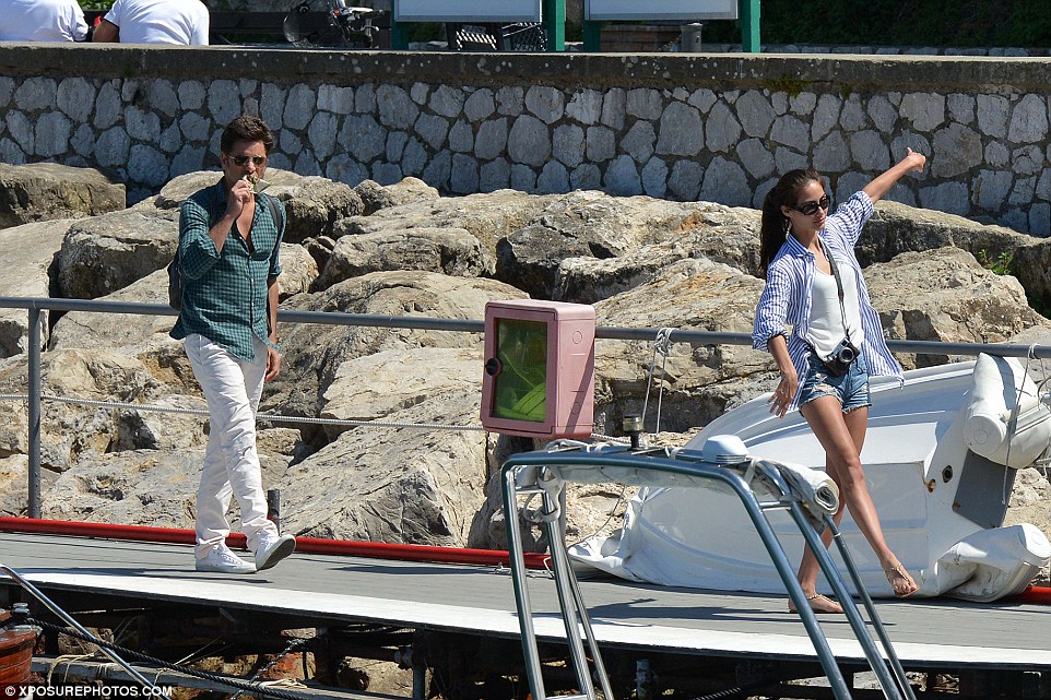 Spring in her step: Caitlin seemed delighted as the couple were seen enjoying a boat ride, sunbathing and eating on a balcony