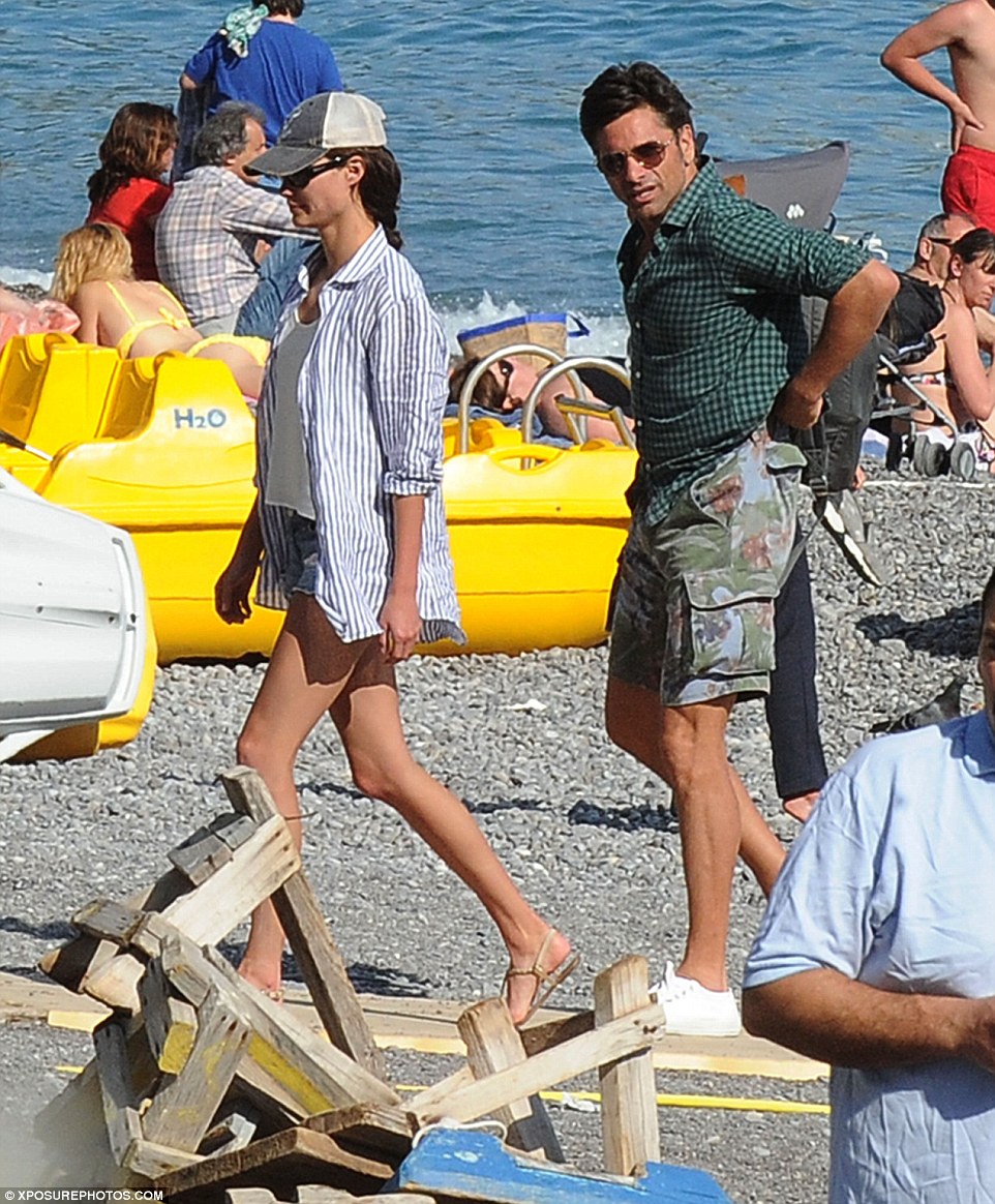 Life's a beach! Navigating the rocky beach, the pair seemed to go incognito as they passed fellow holidaymakers 