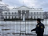 A member of the Uniformed Division of the Secret Service walks past an ice covered fence in front of the White House March 2, 2015 in Washington, DC. AFP PHOTO/BRENDAN SMIALOWSKI        (Photo credit should read BRENDAN SMIALOWSKI/AFP/Getty Images)