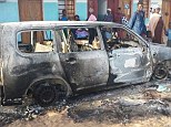 A burnt out van in the town of  Mpeketoni following an attack by Somali militants