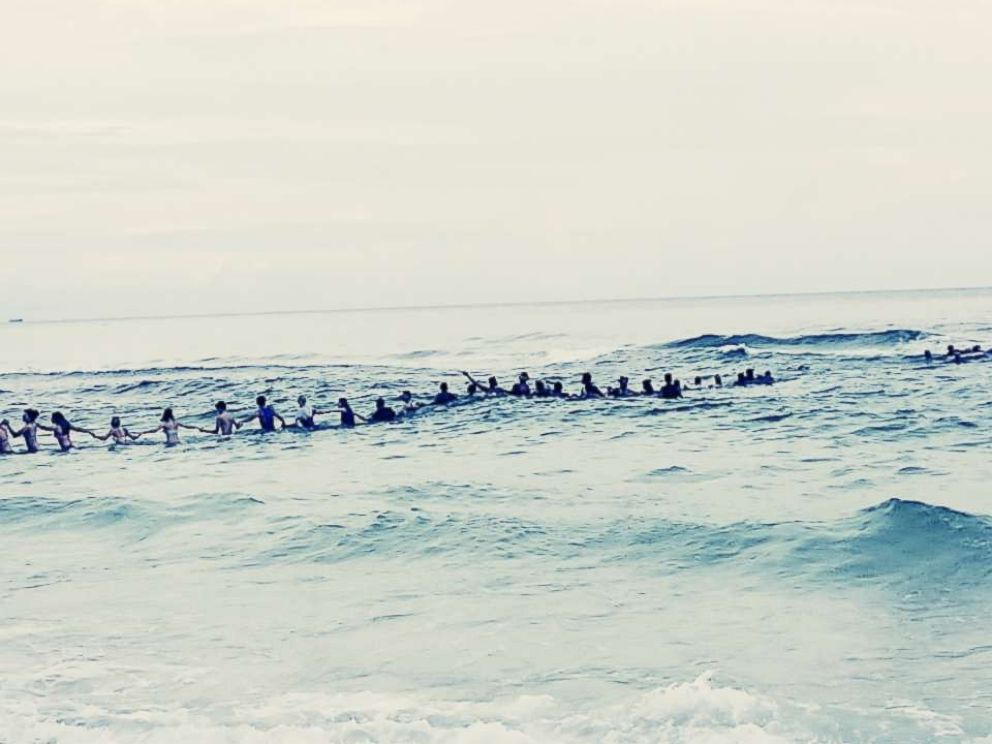 PHOTO: A group of strangers linked arms and waded into the ocean to rescue a group of swimmers stranded off the coast of Panama City Beach, Fla., July 8, 2017.