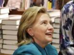 Woman of the people: Clinton mingled and signed books on Monday with fans at the Tattered Cover, a trendy, upscale bookstore in Denver