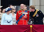 Prince Harry speaks with the Queen on the balcony of Buckingham Palace following the Trooping the Colour ceremony today