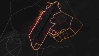 Red heat lines are arrayed neatly in the pattern of roads and streets on a dark black map