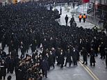 A dance circle is formed after thousands of Orthodox Jews gathered in New York, Sunday, March 9, 2014, on Water Street in lower Manhattan, to pray and protest against the Israeli government's proposal to pass a law that would draft strictly religious citizens into its army. (AP Photo/Craig Ruttle)