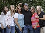 Brady Williams poses with his wives, from left to right, Paulie, Robyn, Rosemary, Nonie, and Rhonda, outside of their home in a polygamous community outside Salt Lake City