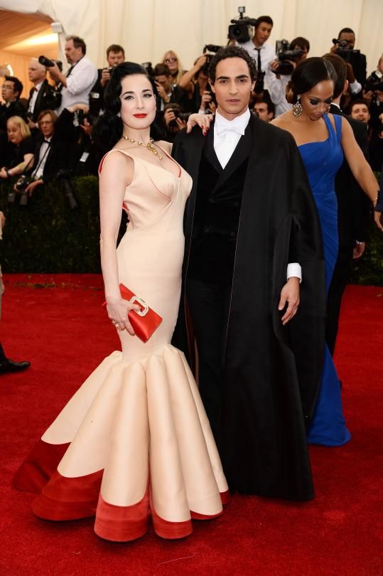 Designer Zac Posen with Dita Von Teese, in one of his gowns, at the 2014 gala, 