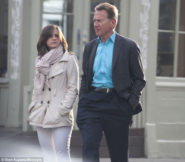 Stepping out: Married BBC presenter Michael Portillo, 60, is seen leaving the London flat of Great British Railway Journeys researcher Erica Gornall, aged 26