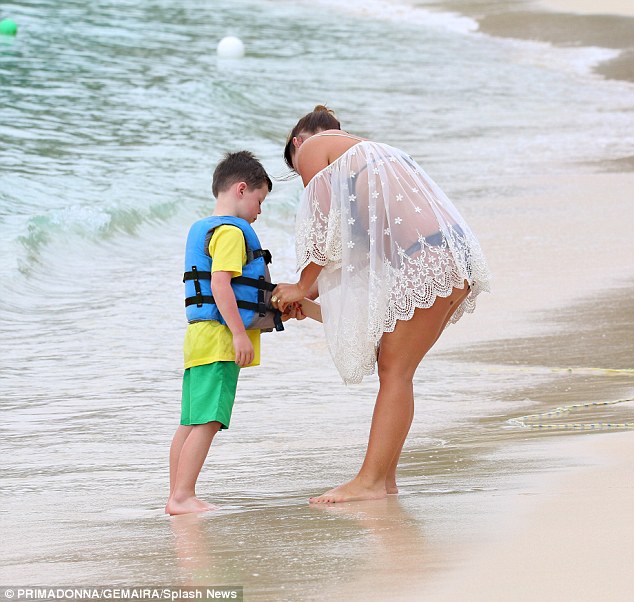 Strapping him in: Coleen ensured Kai was fully strapped in to his life jacket