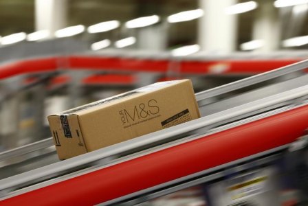 A parcel travels along a belt at the new Marks  Spencer e-commerce distribution centre in Castle Donington, central England May 8, 2013. REUTERS/Darren Staples