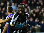 NEWCASTLE UPON TYNE, ENGLAND - DECEMBER 06:  Papiss Cisse of Newcastle (r) celebrates after scoring the opening goal during the Barclays Premier League match between Newcastle United and Chelsea at St James' Park on December 6, 2014 in Newcastle upon Tyne, England.  (Photo by Stu Forster/Getty Images)