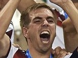 Out with a bang: Philipp Lahm (centre) has retired from international football after winning the World Cup