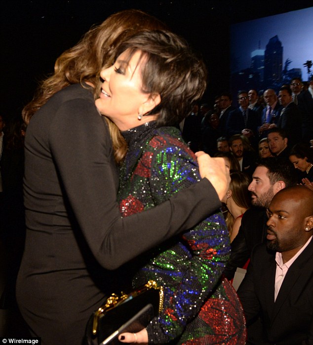 Hugging it out: Caitlyn embraced the matriarch while Kris's boyfriend Corey relaxed in the audience 